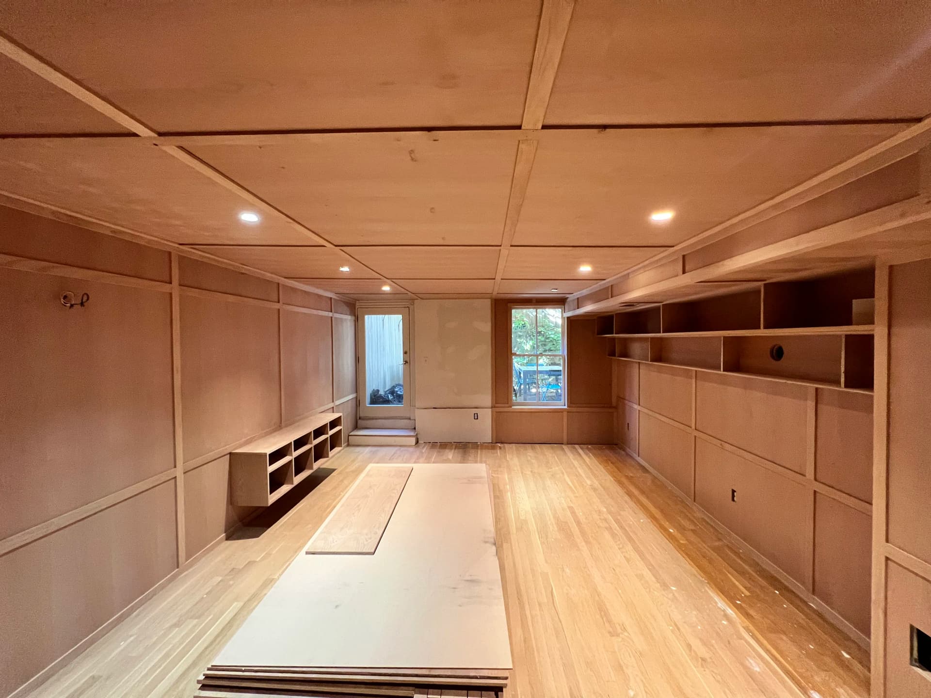 Basement Finishing with Custom Alderwood Built-Ins and Coffered Ceiling image