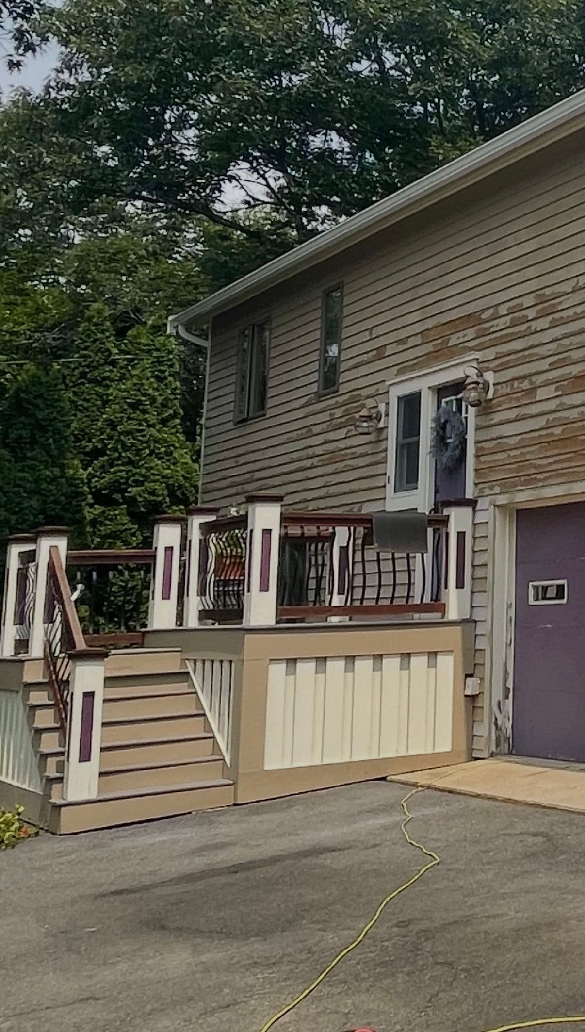 Faded Siding to Bold Navy Blue Exterior Paint Job image